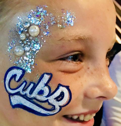 Chicago Cubs face painting with gems and glitter 